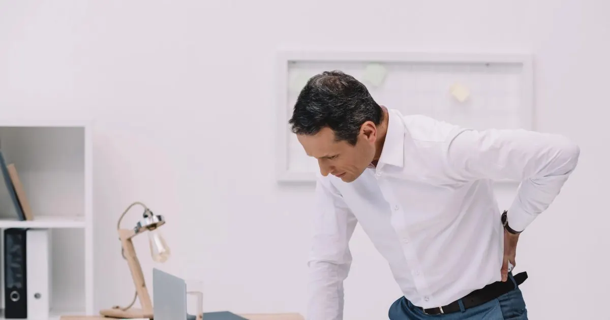 Man experiencing back pain