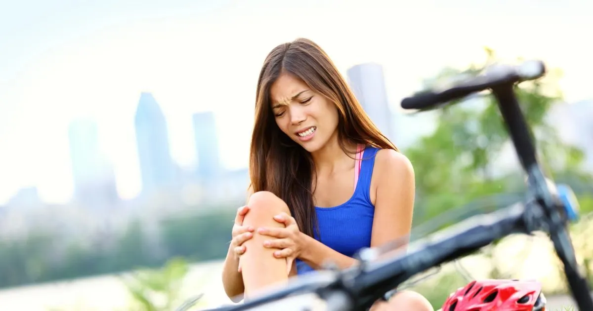 Woman holding her knee