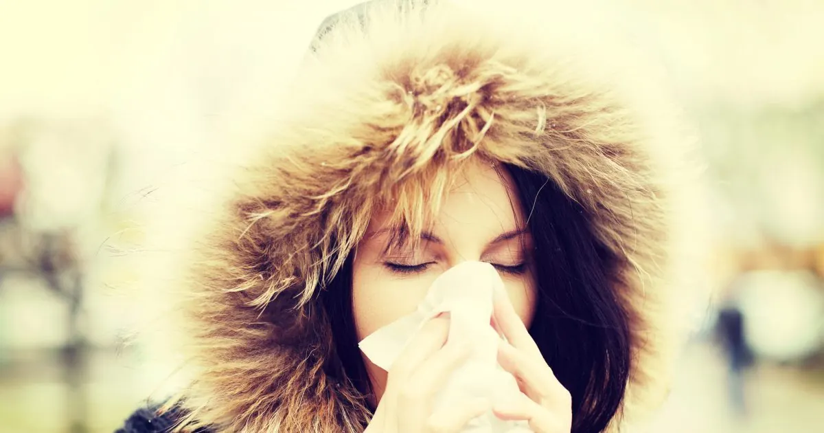 Woman sneezing